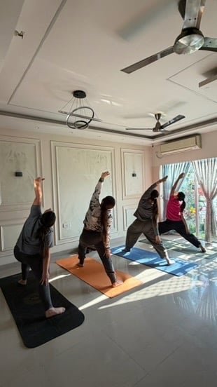 Students in Vipreet Virabhadrasana during class